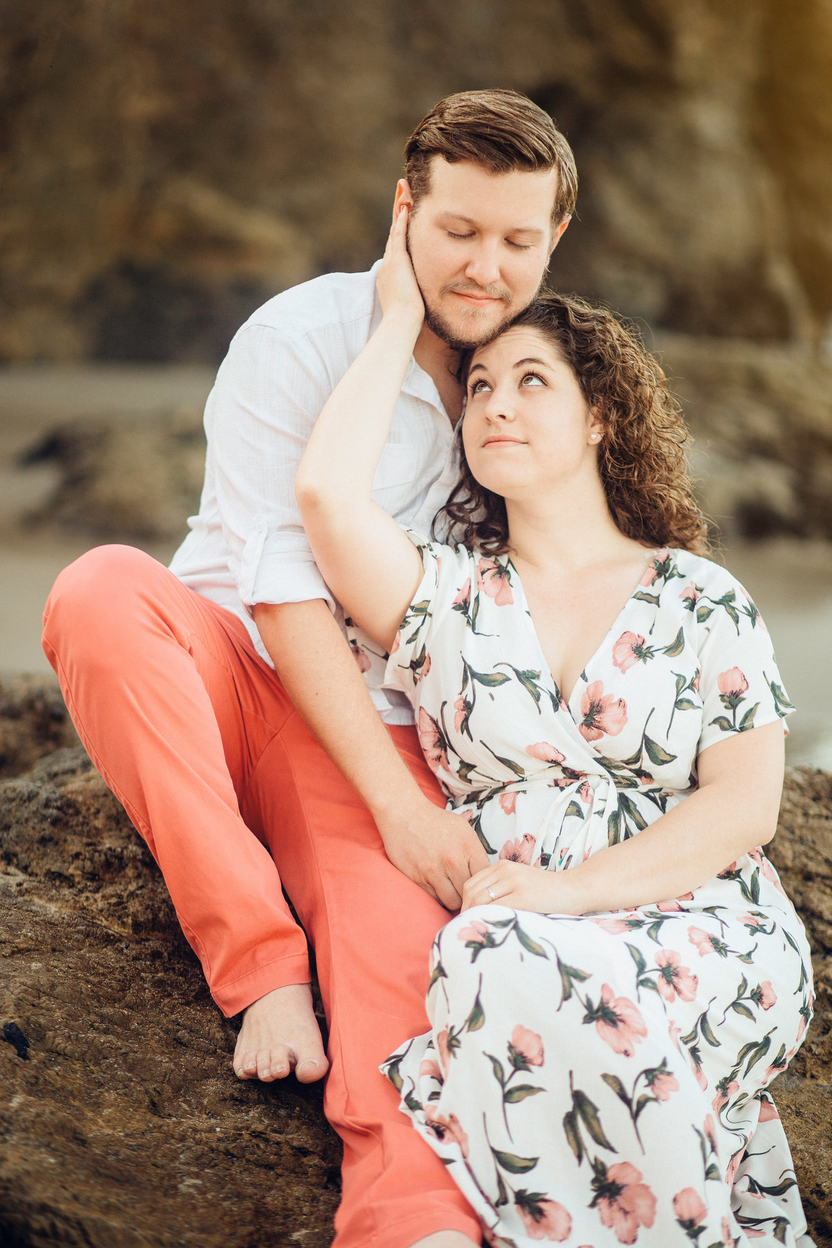 Engagement Photograph Of  Man  In Orange Slacks And Woman In Floral Dress Los Angeles