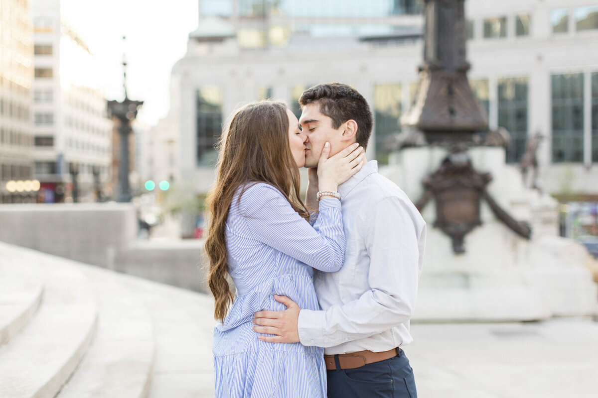 downtown indianapolis engagement session, couple kissing