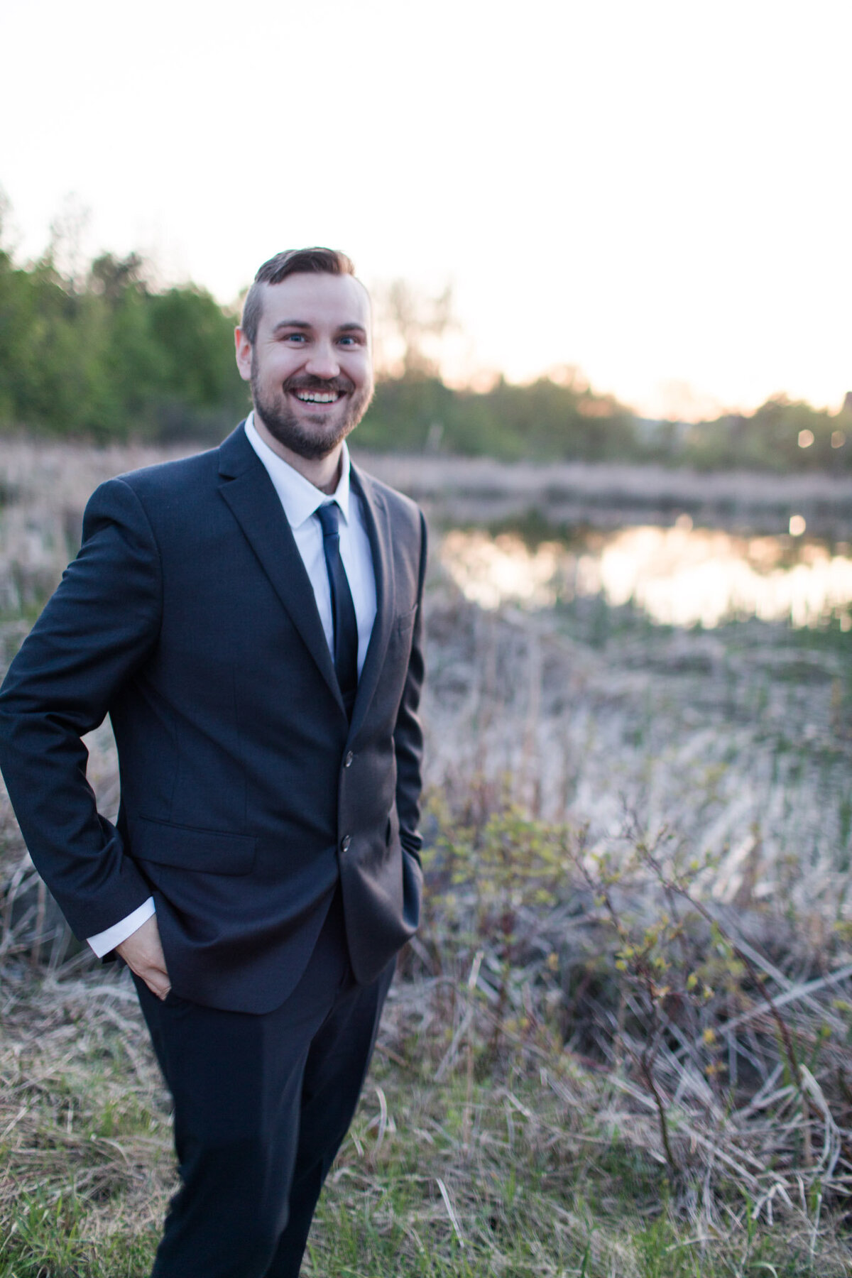 Explore the epitome of refined elegance in David's dapper portrait, as expertly captured by Ottawa Wedding Photographer, Lauren Duffy. Dressed in his impeccably tailored wedding suit, David exudes sophistication with hands casually tucked into pockets. Lauren Duffy Photography skillfully preserves the timeless charm, creating a portrait that resonates with the essence of Ottawa weddings. Immerse yourself in the artistry that defines each frame, as Lauren Duffy expertly captures the sophistication and poise that make David's portrait a testament to the grace and style synonymous with Ottawa's premier wedding photographer.