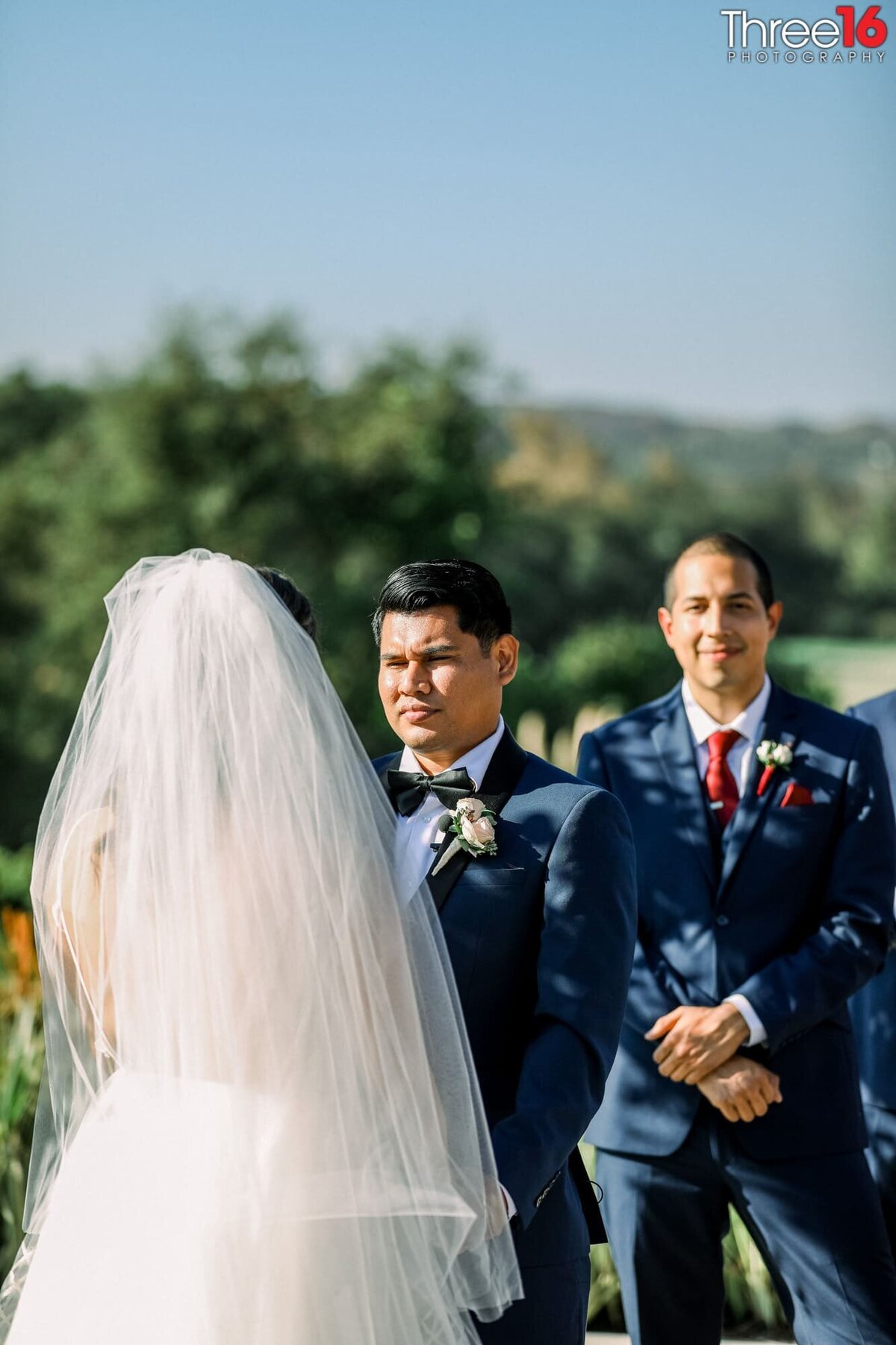 Groom stares at his Bride as she takes her vows to him