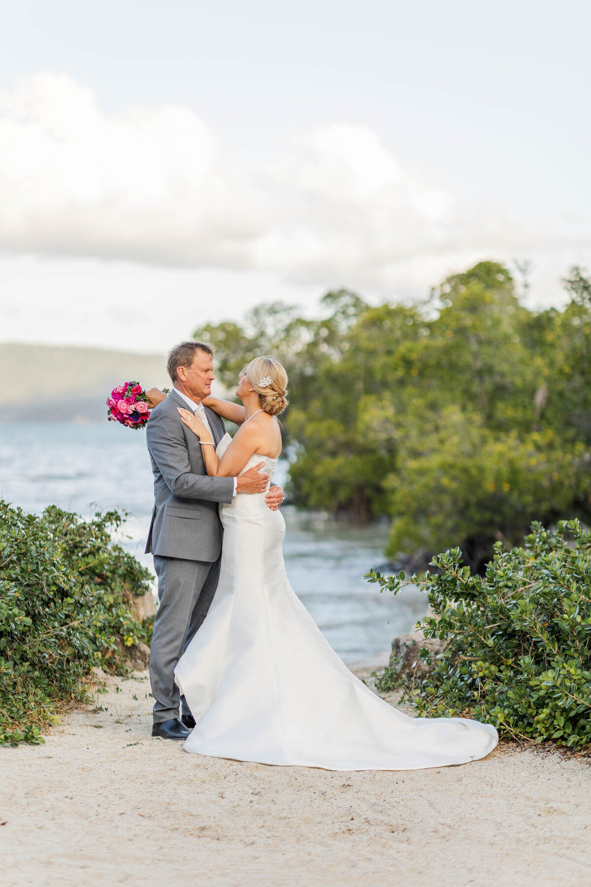 Bride and groom posed during Mr and Mrs photo tour on their wedding day in Airlie beach