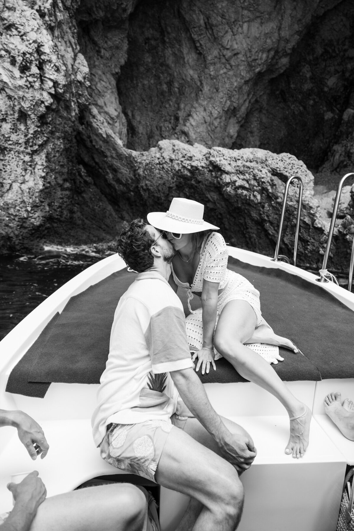 Black and white photo of the bride and groom kissing