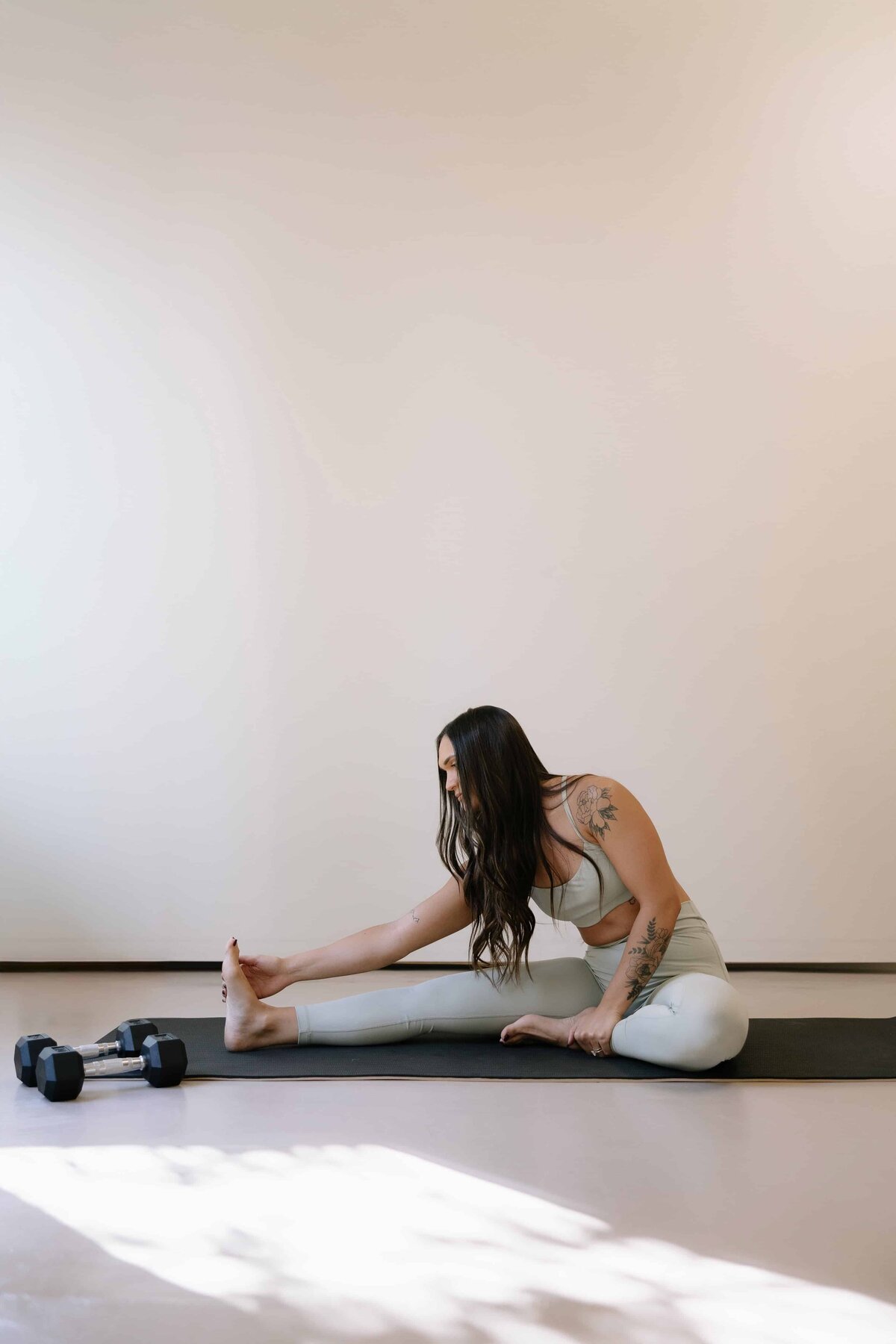 A fitness coach stretches during her personal branding session in Northern Colorado.
