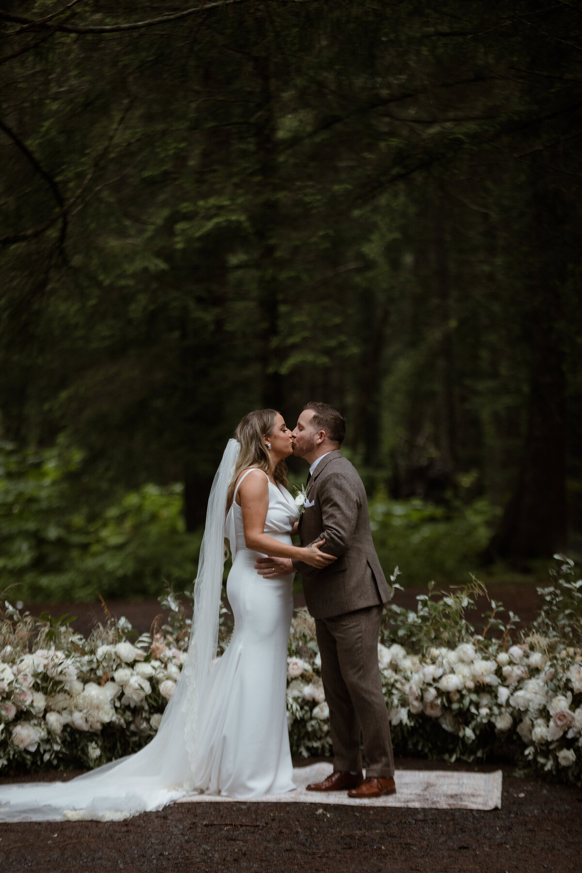 Bride and groom first kiss