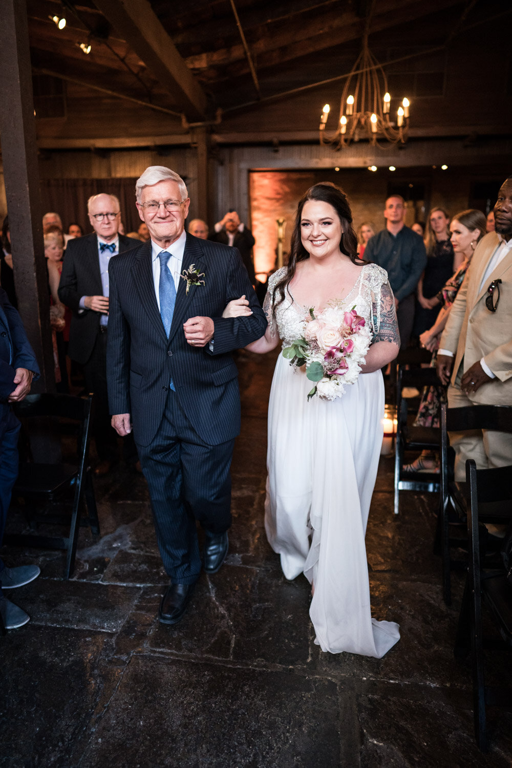Bride and father walking down the aisle