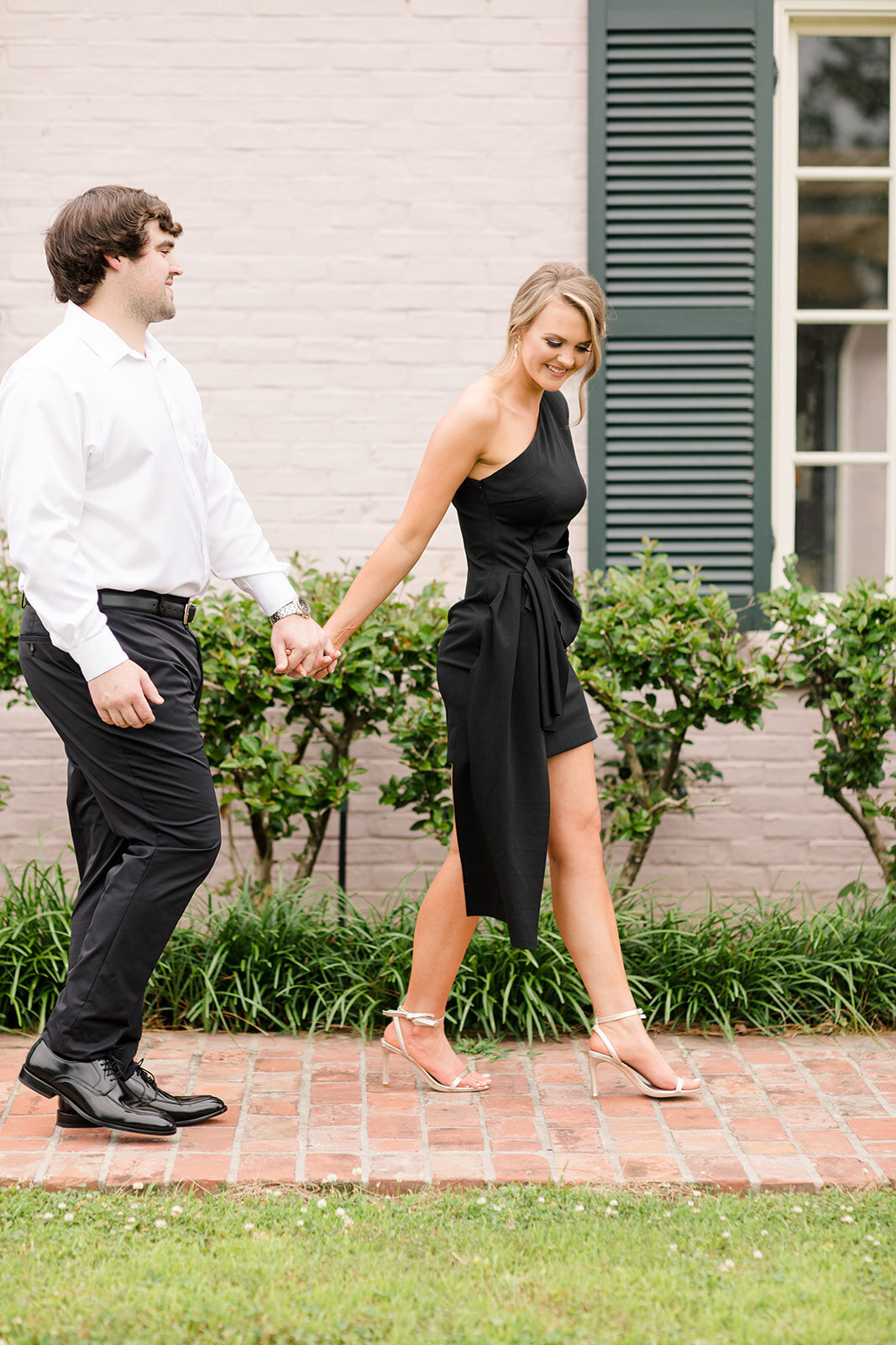Engagement photo of couple walking at The Mansion at Red Hill; Delhi, Louisiana