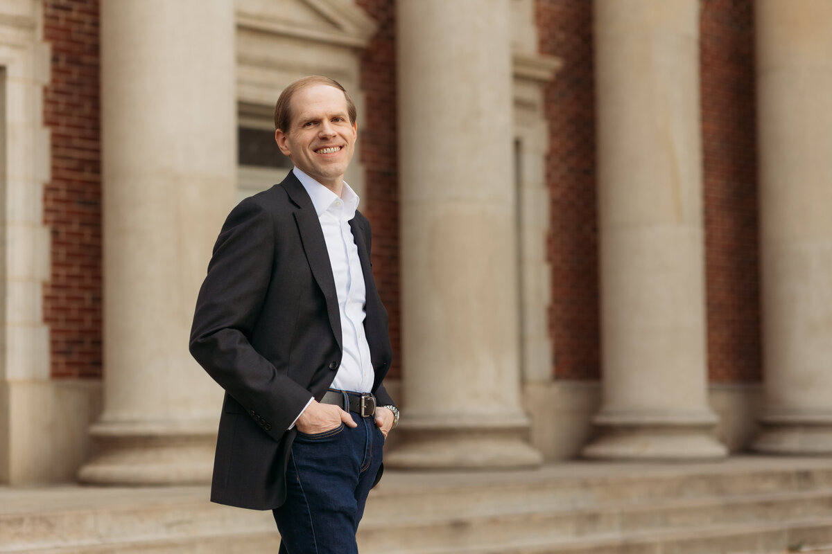 A professor of music and composer, Dr. James David, poses for a headshot outside Colorado State University.