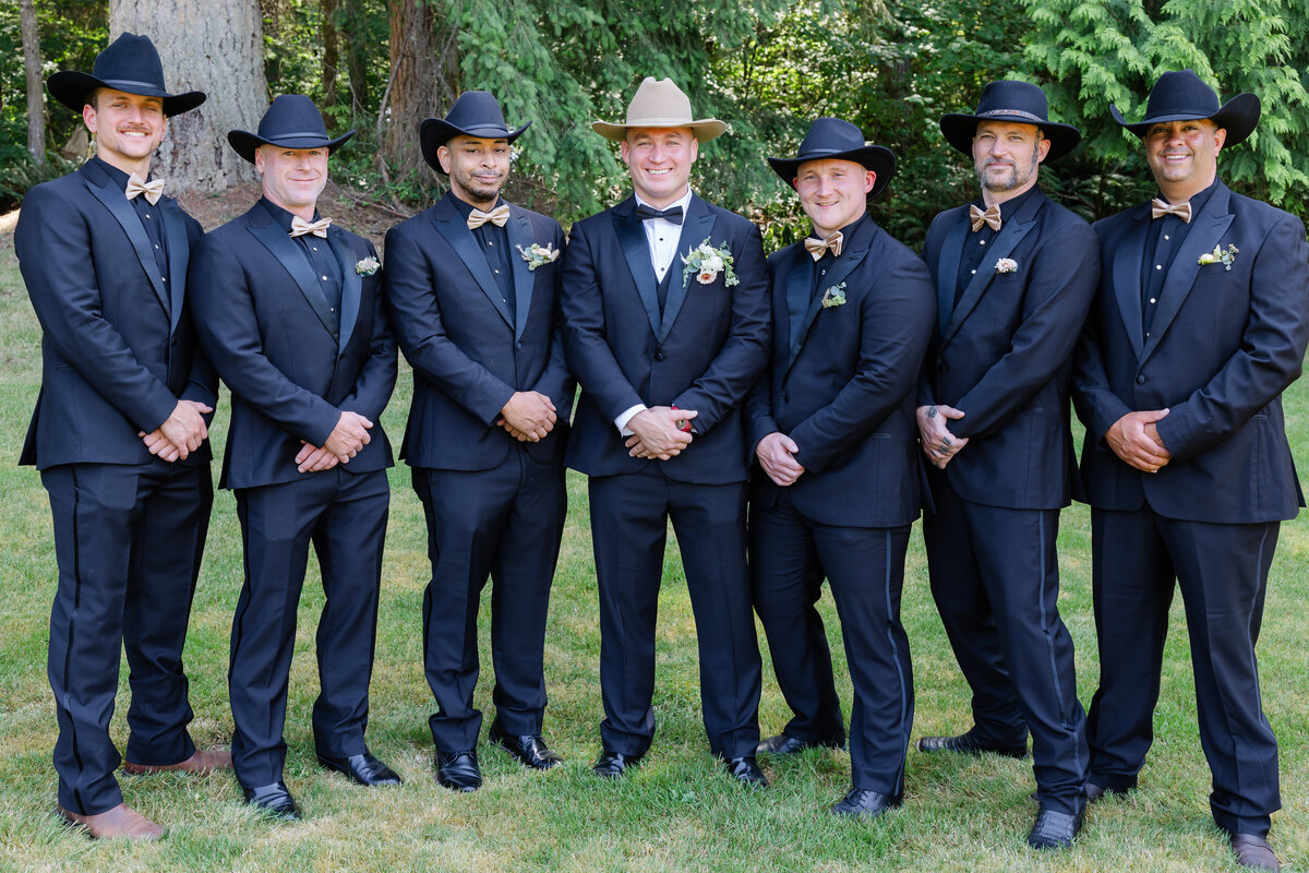 groomsmen wedding in tux and cowboy hats