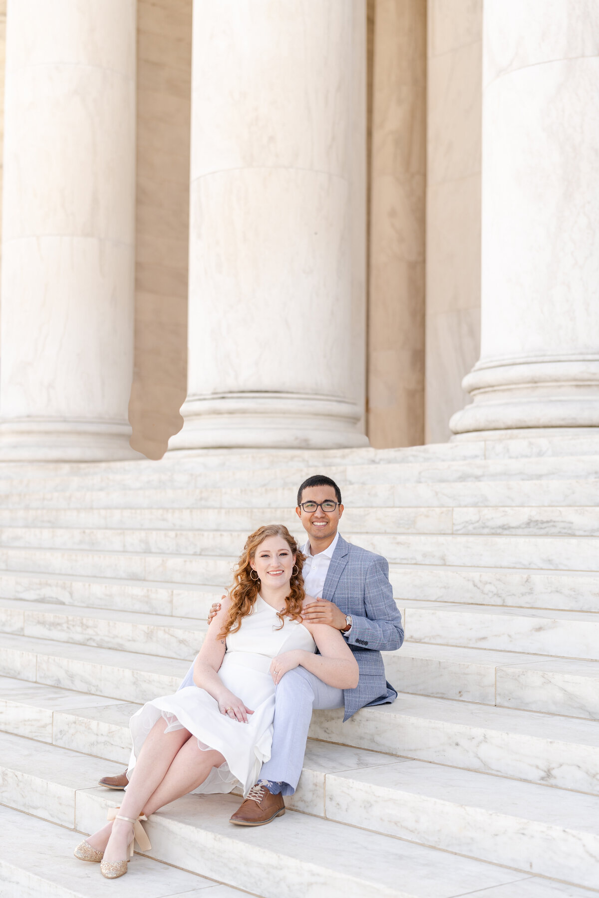 Future bride and groom sitting on Lincoln monument stairs in DC