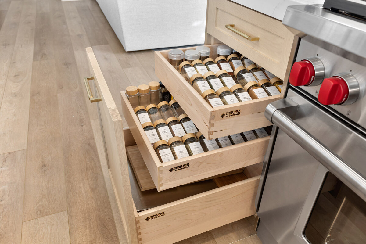 Marrying classic elements like wooden cabinets with contemporary touches such as the marble island and gold accents, this kitchen is timeless. It promises years of culinary adventures and family memories.