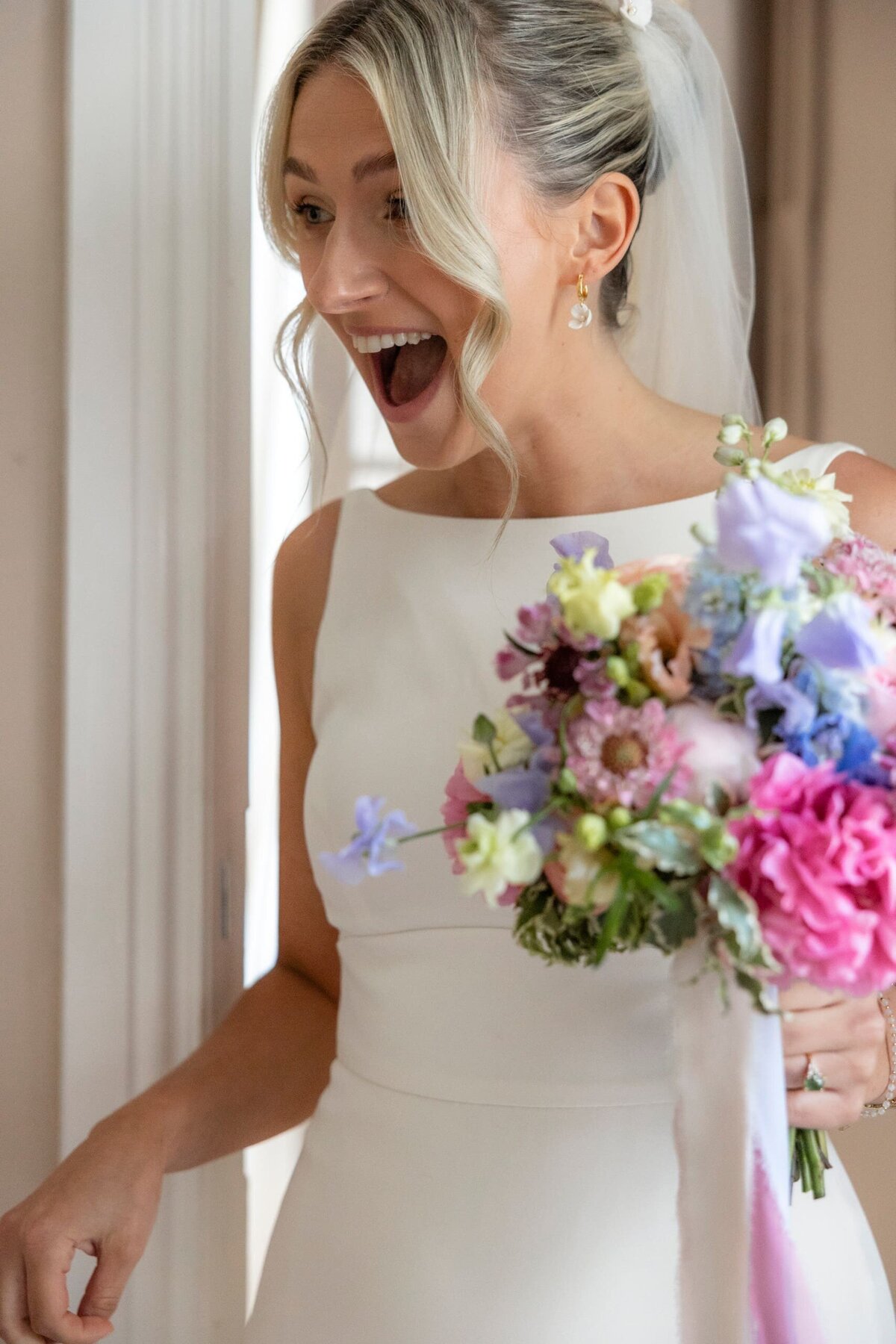 emotional-bride-holding-bouquet-france