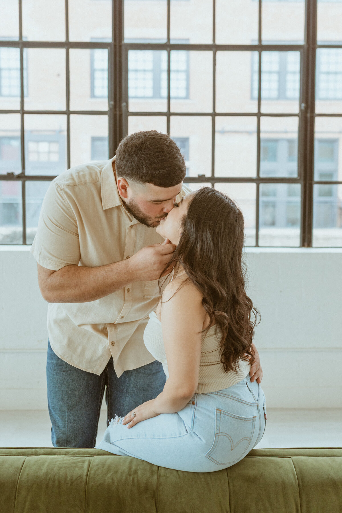 As a wedding photographer capturing an engagement photoshoot in Houston, I had the pleasure of working in a studio that exuded the ambiance of a chic loft, just a stone's throw away from downtown. With its industrial-inspired decor and expansive windows flooding the space with natural light, every corner of the studio served as a canvas for capturing the couple's love in a contemporary and stylish setting