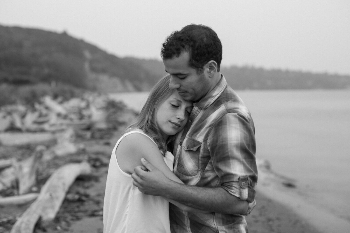 Calm romantic black and white engagement photograph at Discovery Park Beach in Seattle WA photo by Joanna Monger Photography