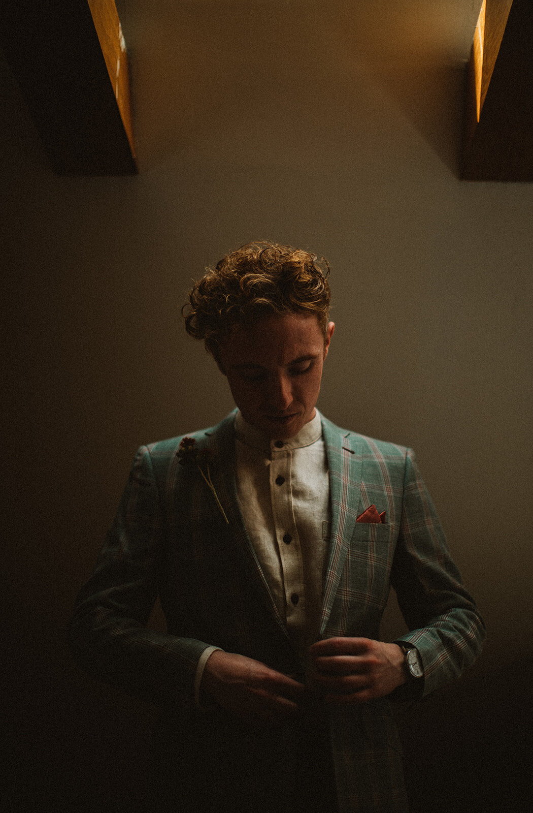 moody grooms portraits with green suit 