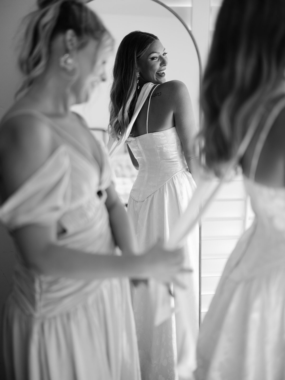 Bride having dress fixed for Southern California wedding