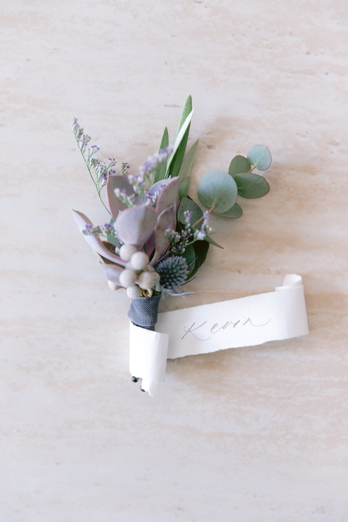 wedding-boutonniere-with-calligraphy-scroll