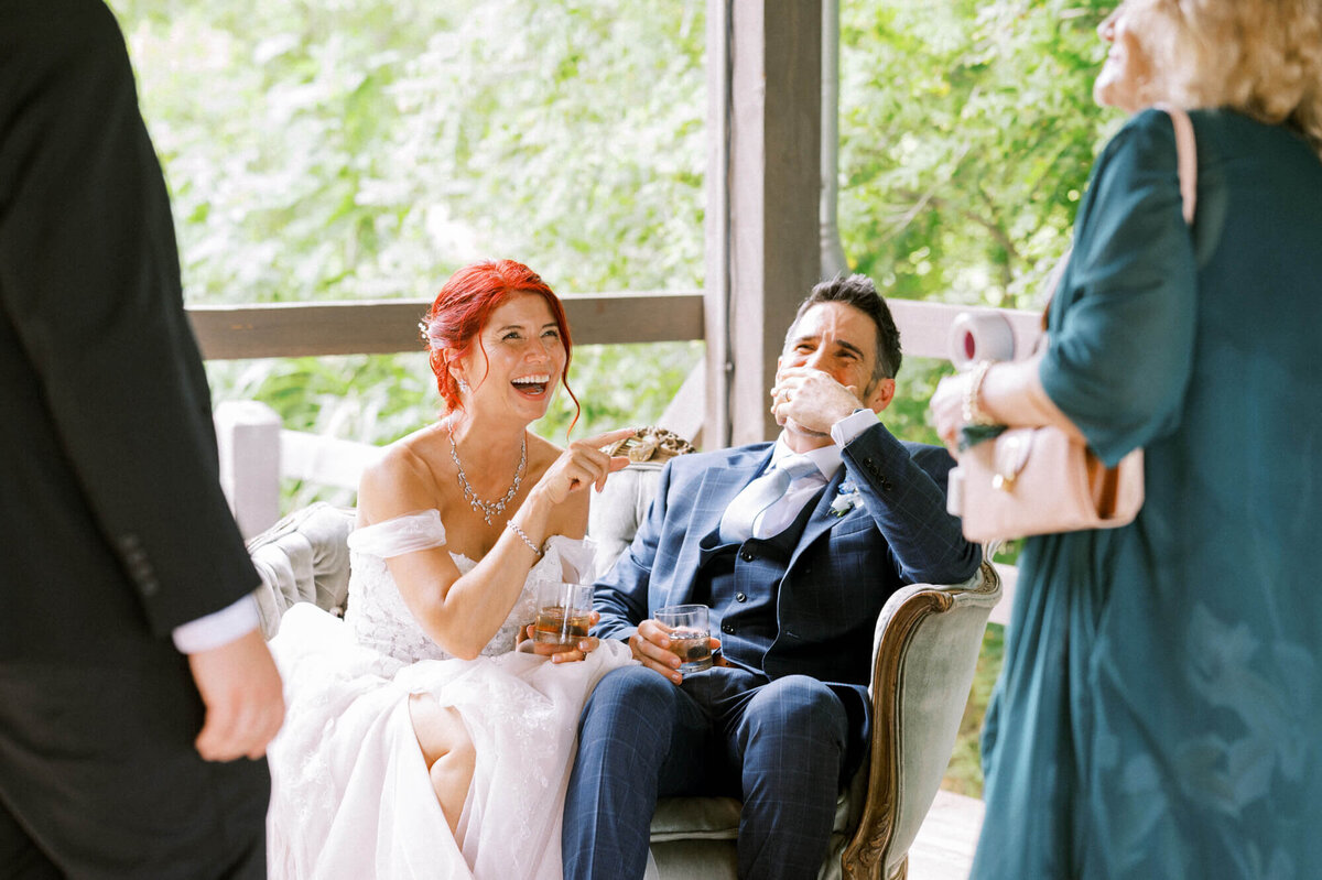 bride-groom-laughing-with-guests