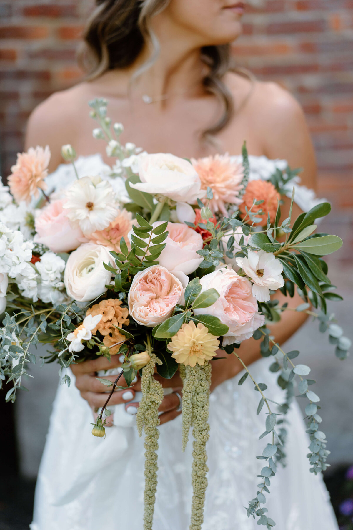 bridal bouquet of peach, ivory and greenery
