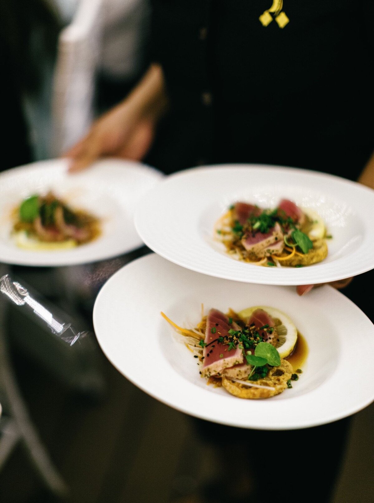 Server Holding Plates of Food