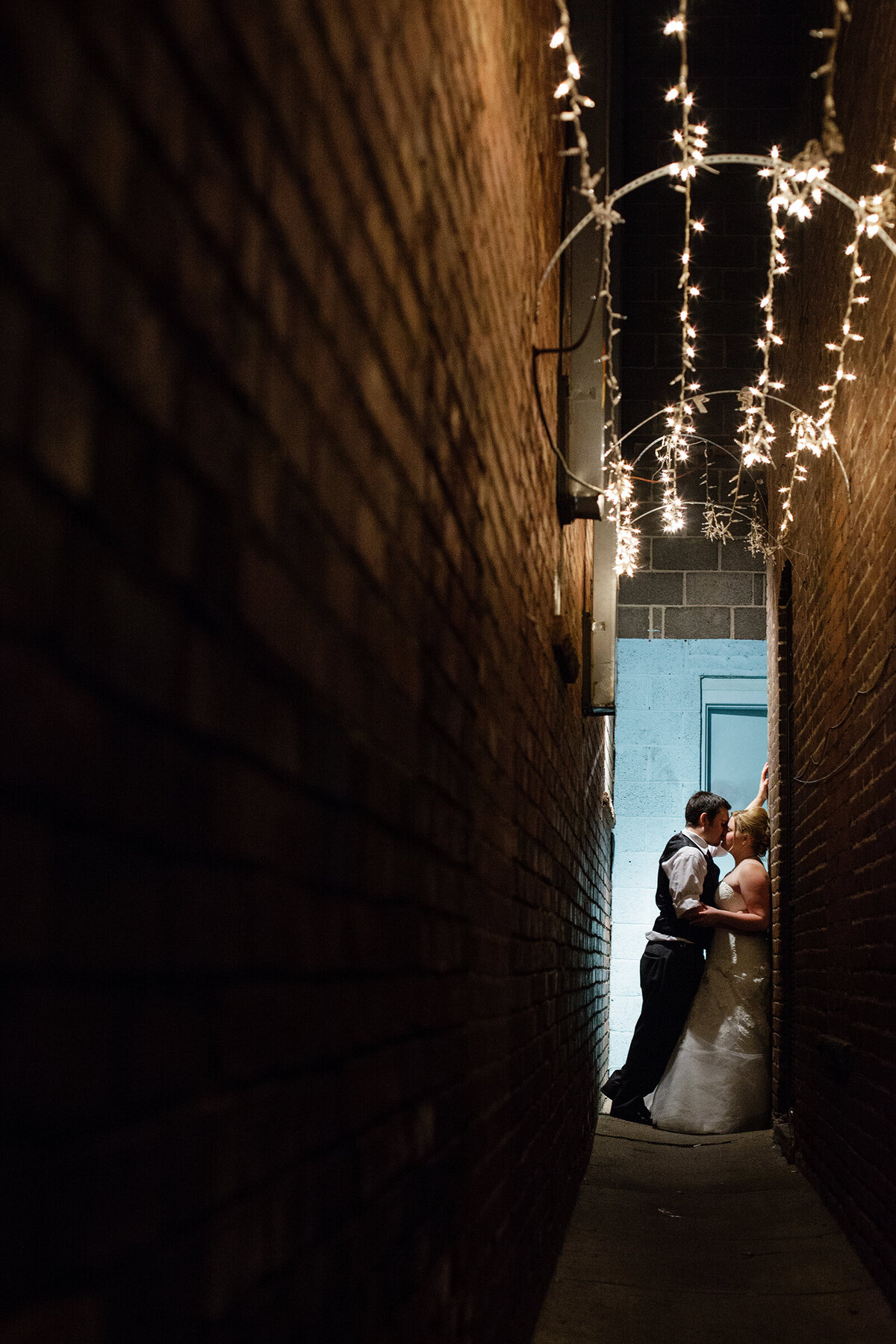 nighttime-romantic-alley-photo-of-bride-and-groom-downtown-denver-colorado