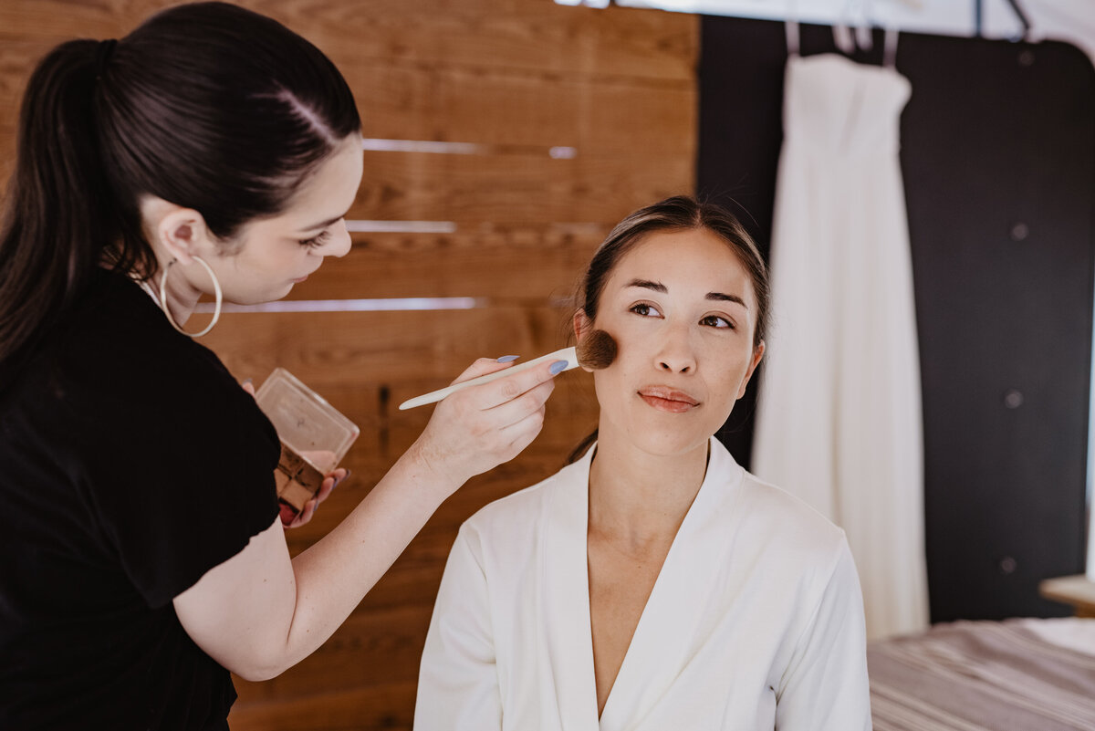 Utah Elopement Photographer captures bride getting makeup done before Moab Utah elopement