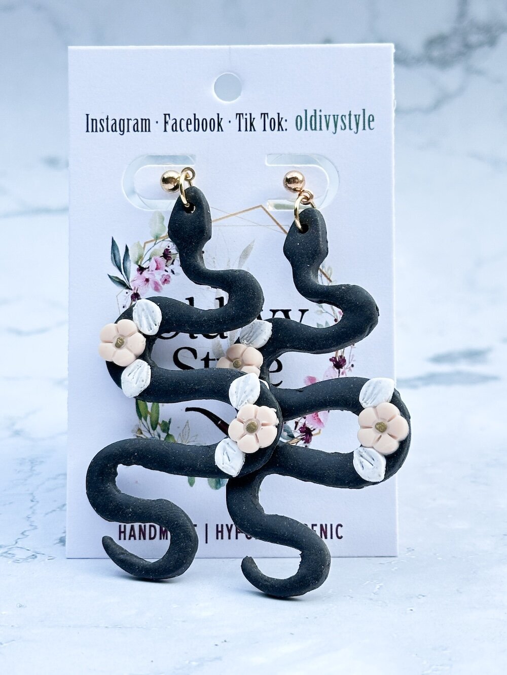 Pair of Old Ivy style hypoallergenic earrings black snake with white flowers