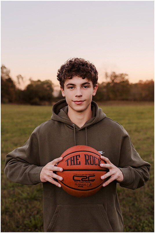 senior basketball player in field