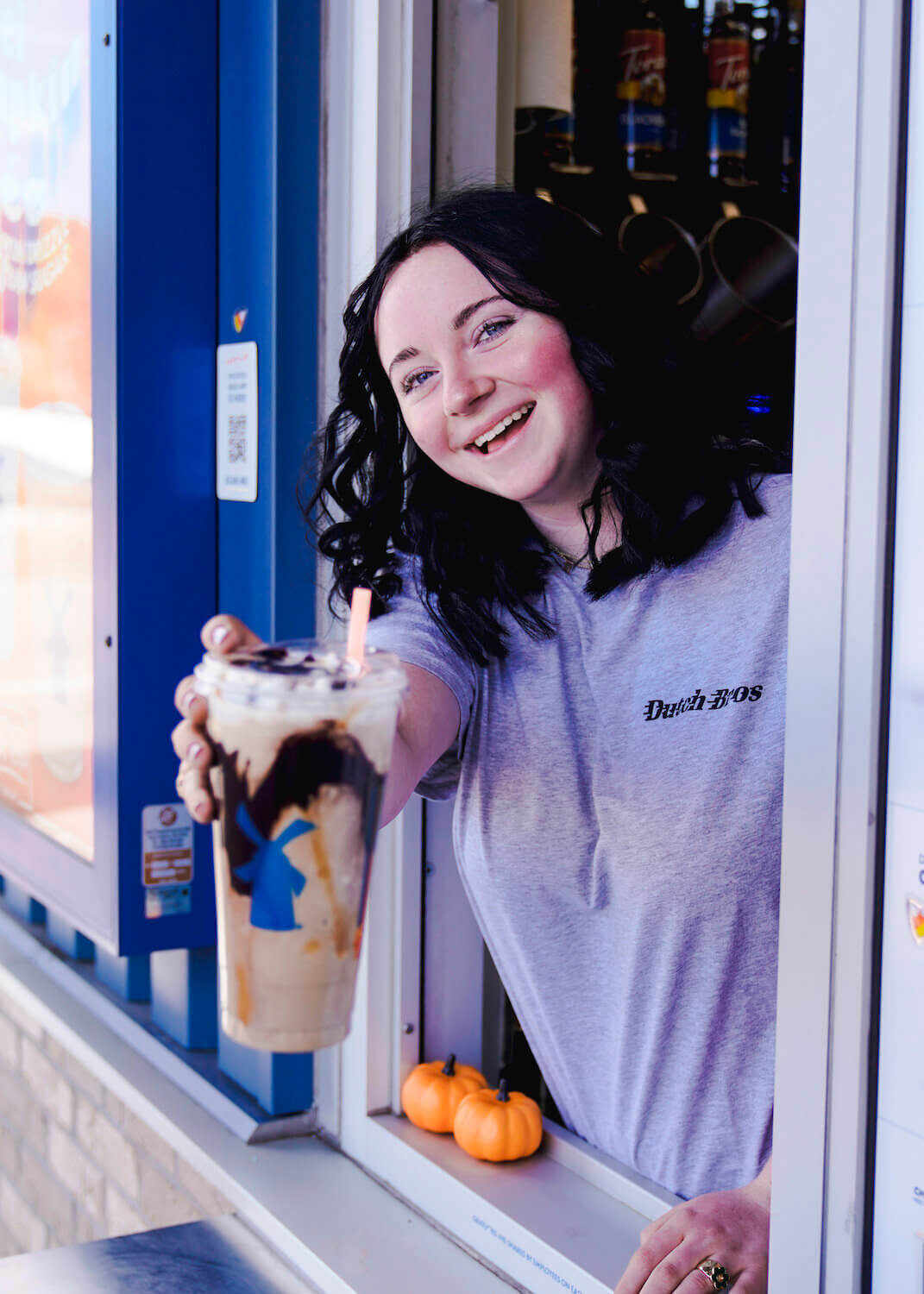 denver photography senior pictures - girl holding out drink