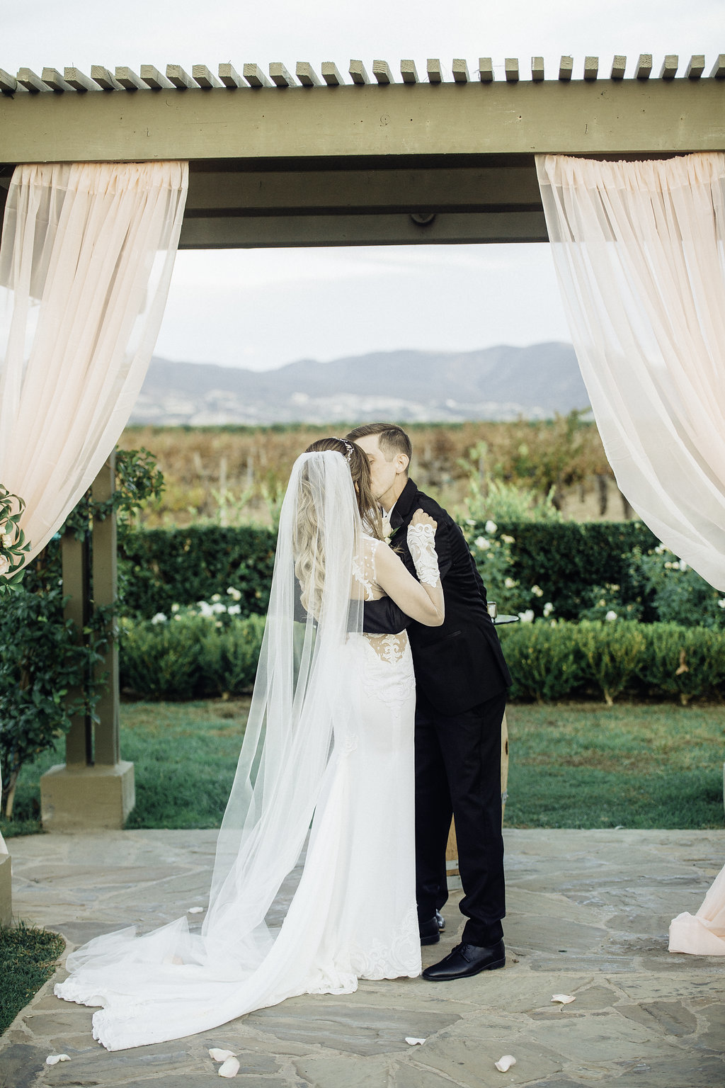 Wedding Photograph Of Bride And Groom Kissing Los Angeles