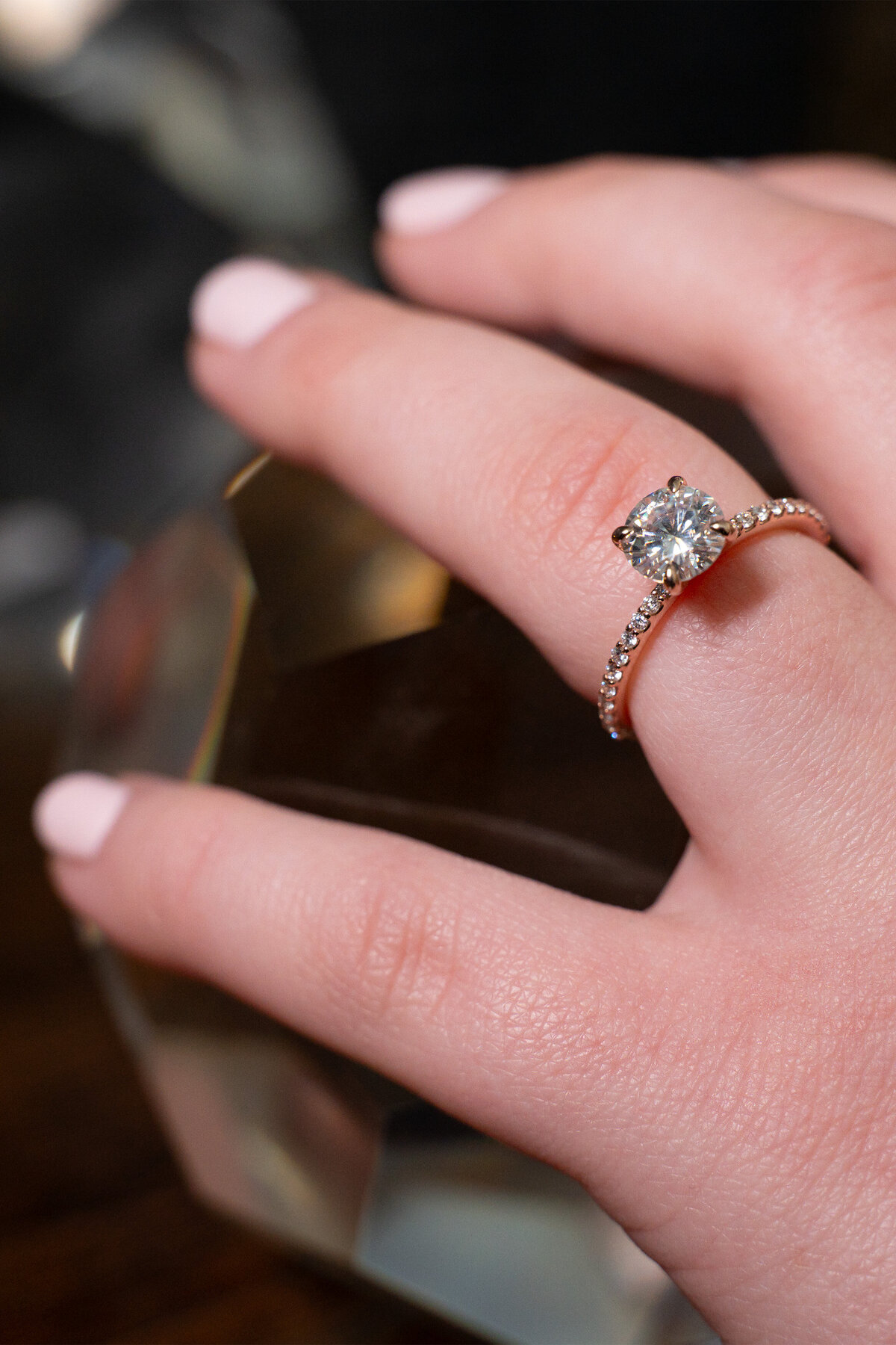 Rose gold accent engagement ring with claw set diamond