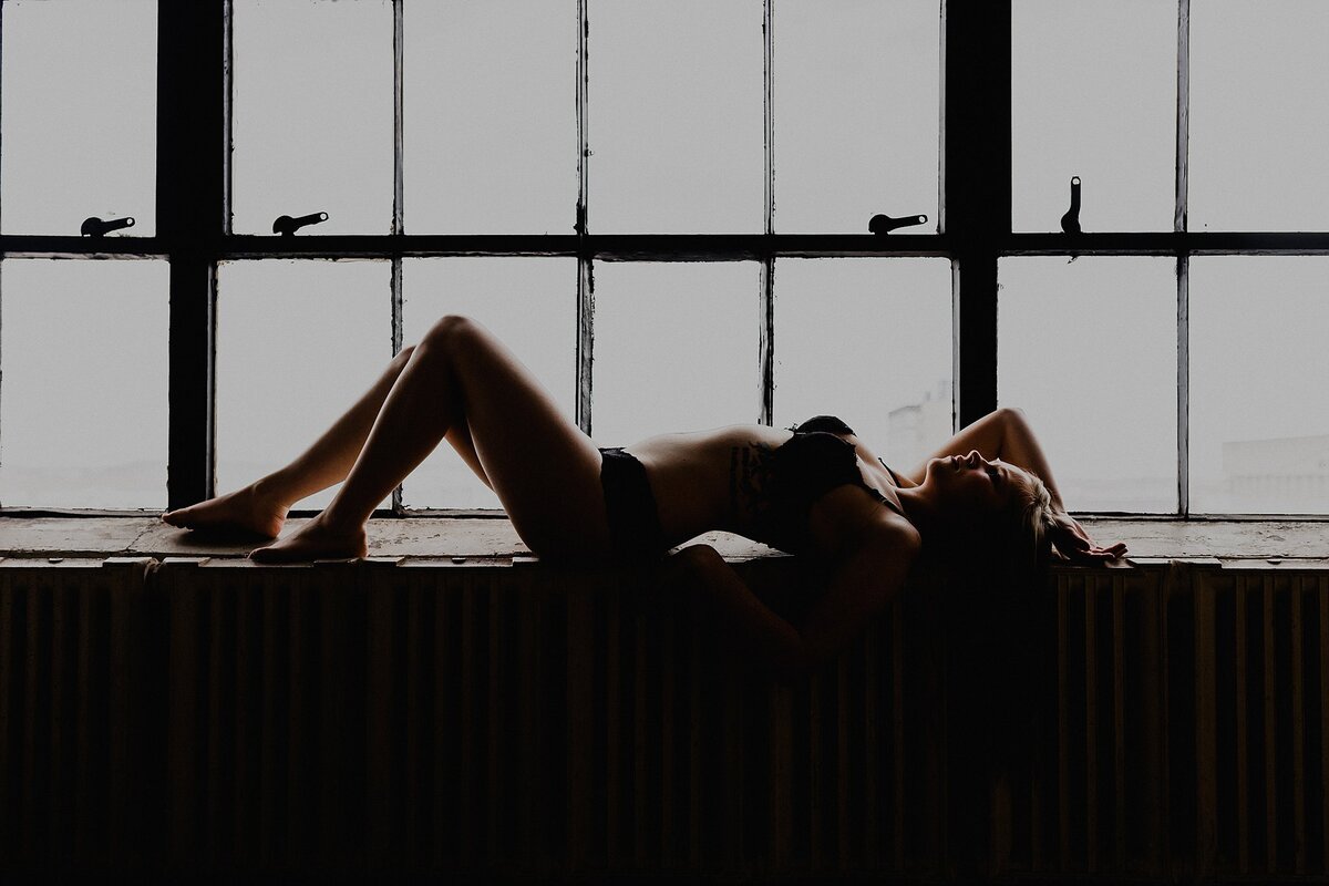silhouette of girl in window
