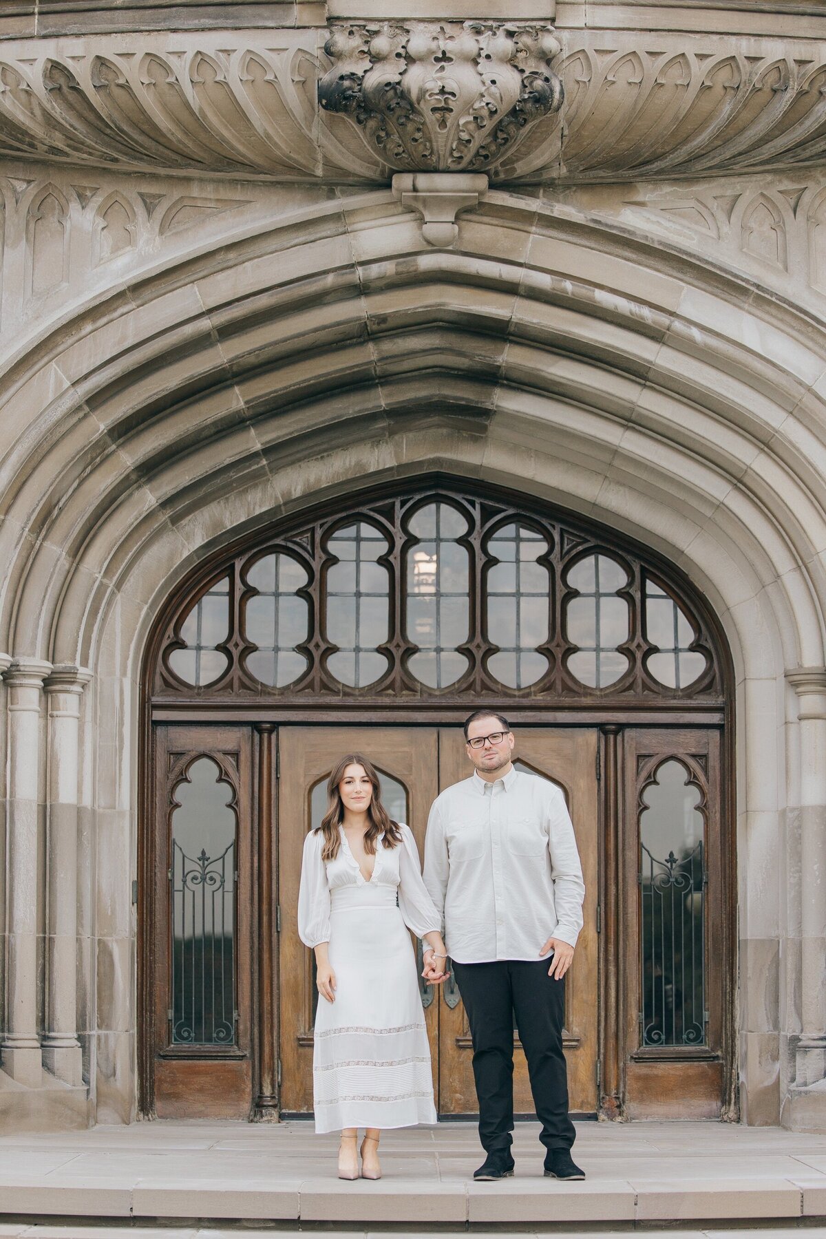 Engaged couple posing for photos at Western University for their engagement session by NovaMarkina Photography