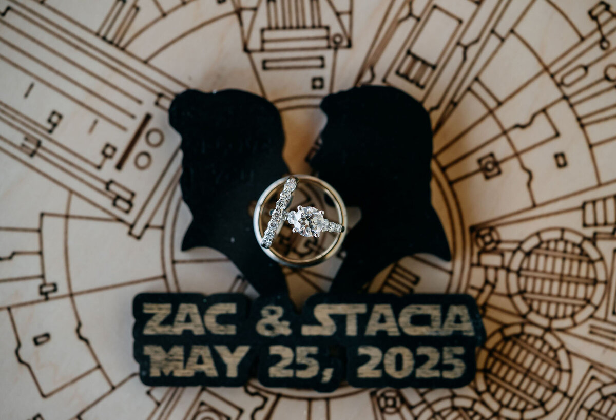 Wedding rings displayed with personalized date and names