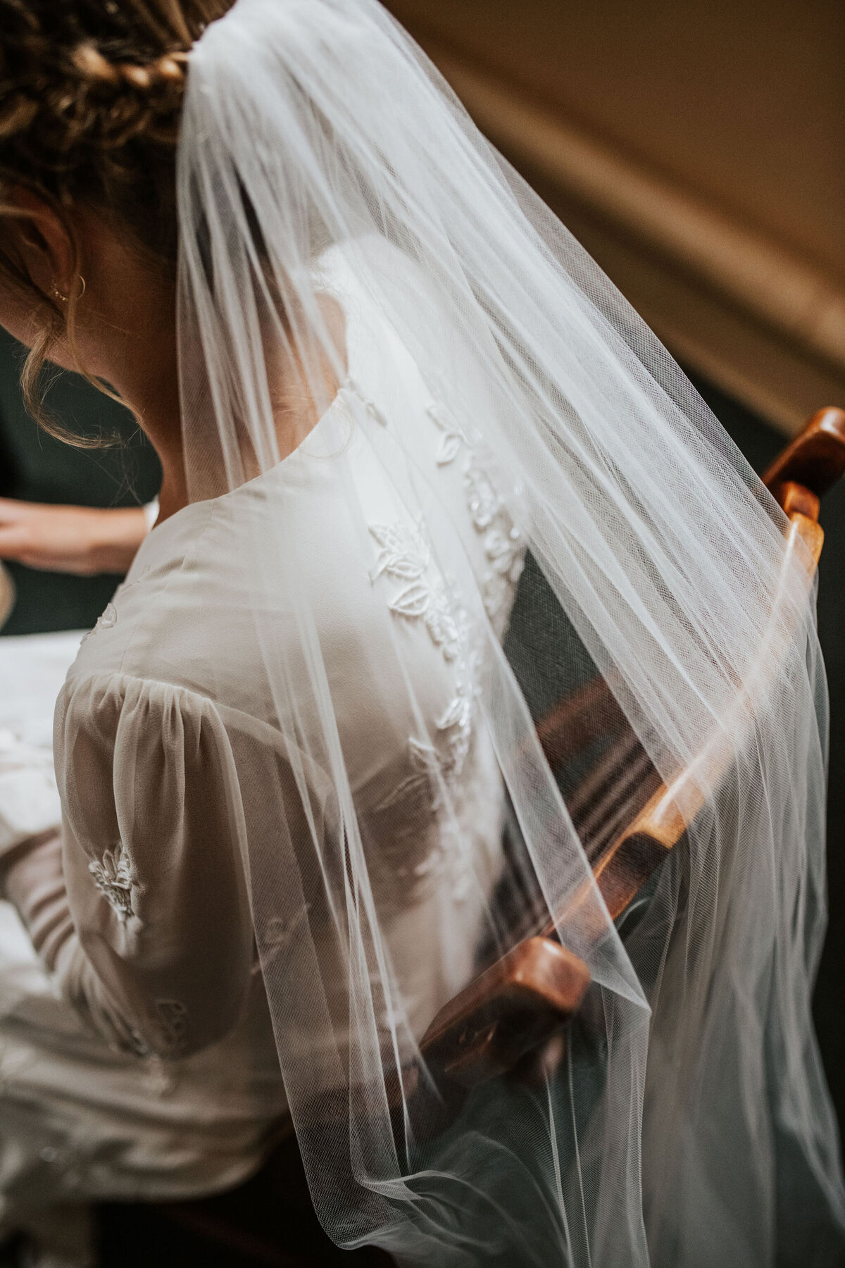 close up of a bride's veil and wedding dress