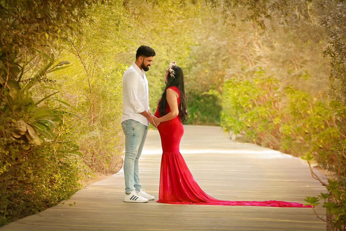 Romantic couple pregnancy photo session in the park by Calgary family photographer
