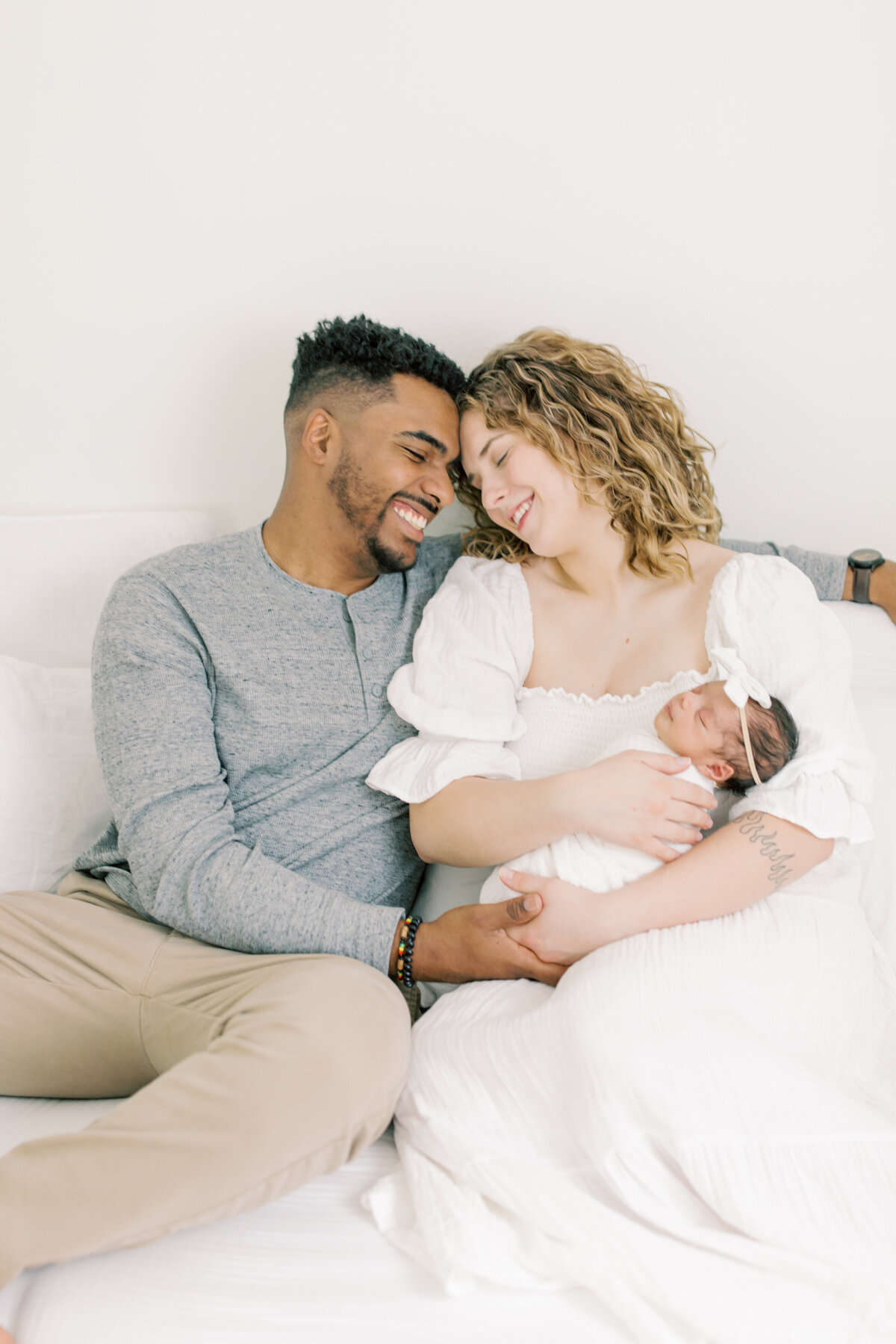 parents holding newborn baby taken by spokane photographer