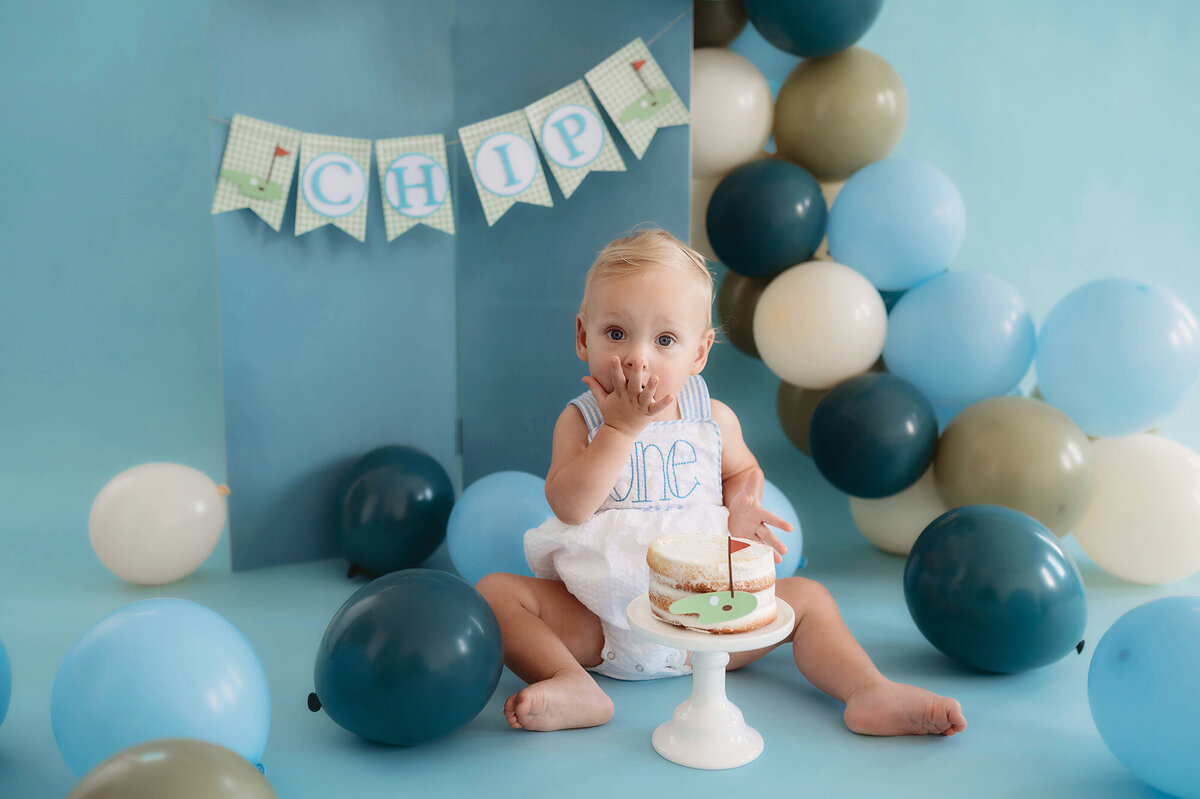 Baby celebrates his first birthday with a Cake Smash Photoshoot in Charleston.