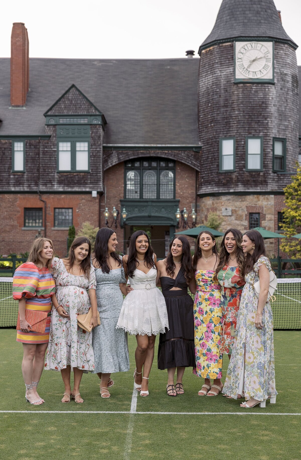Guests mingle on the lawn of the Tennis Hall of Fame  in Newport during a welcome party. 