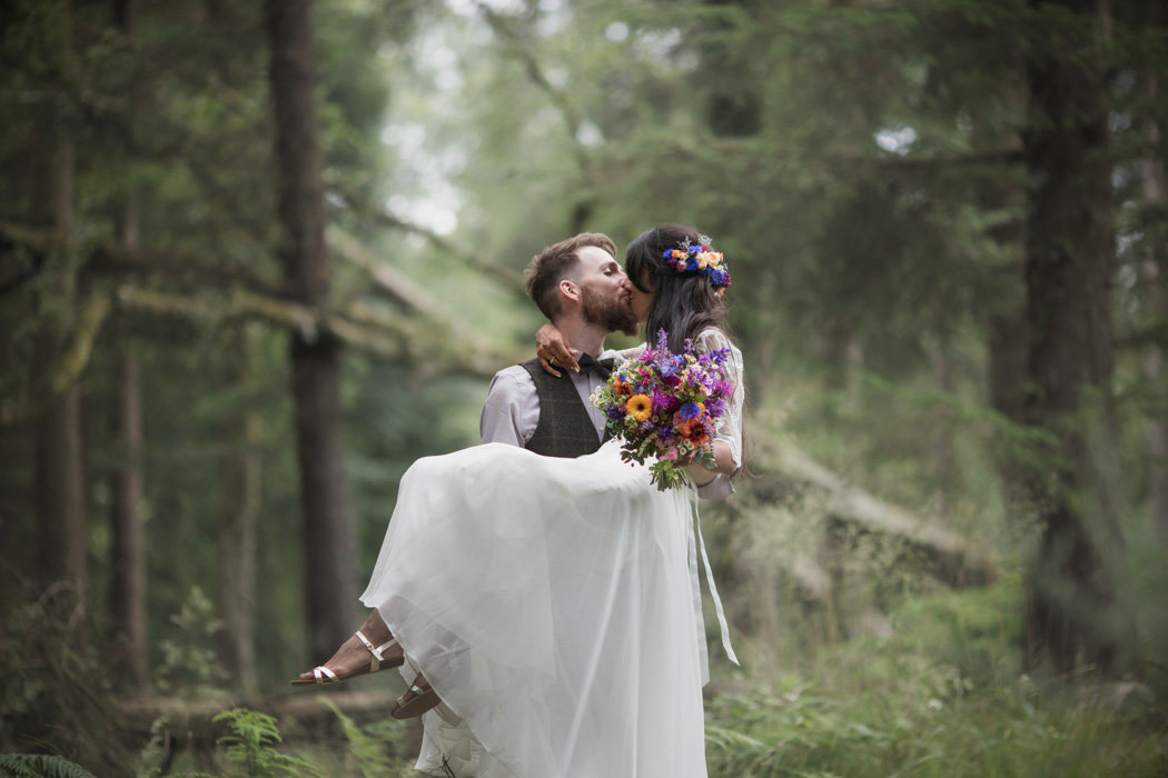 Wedding Photo taken of groom holding Bride at rural Devon Wedding