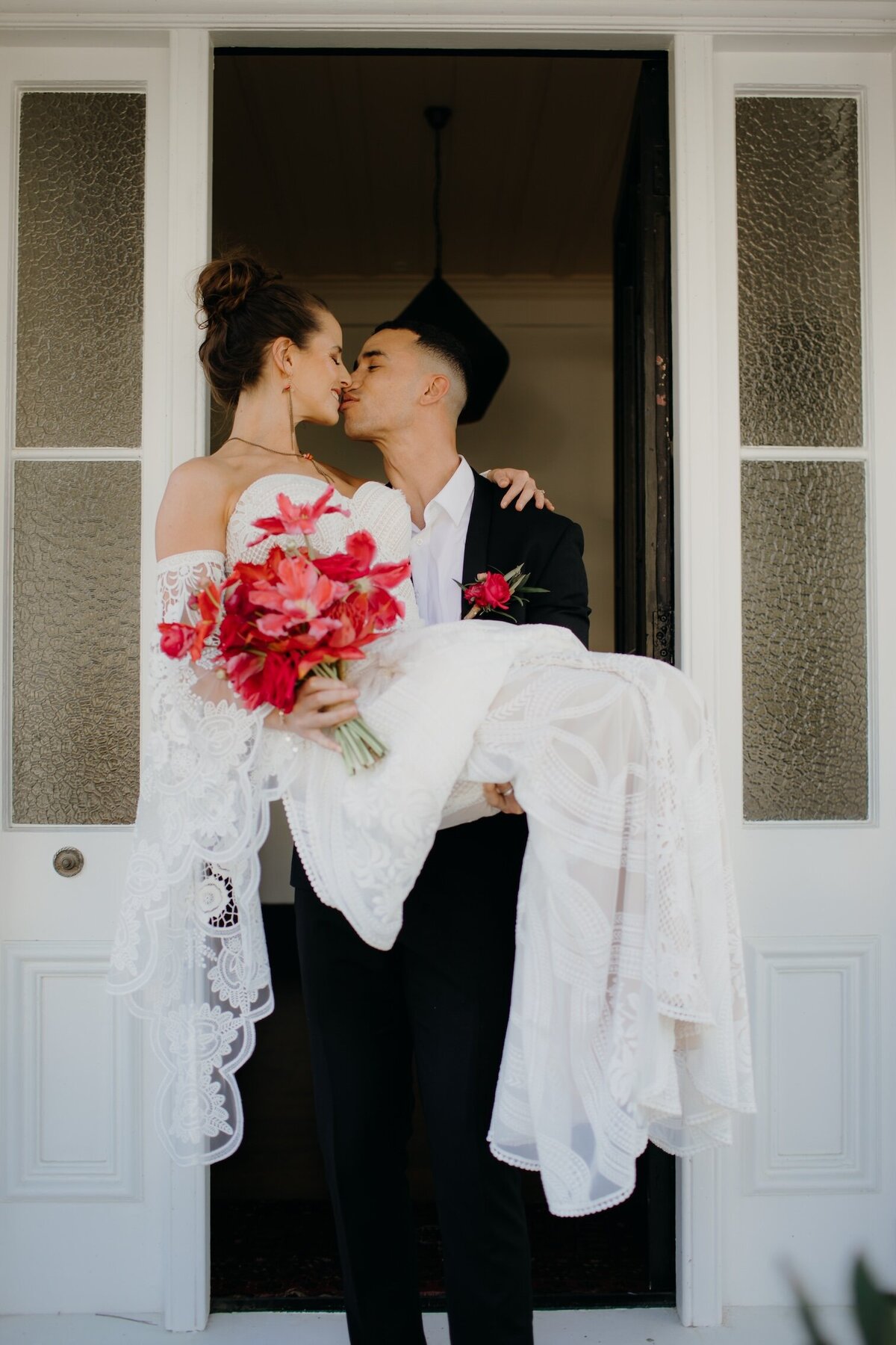 Bride and groom celebrating bespoke wedding NZ