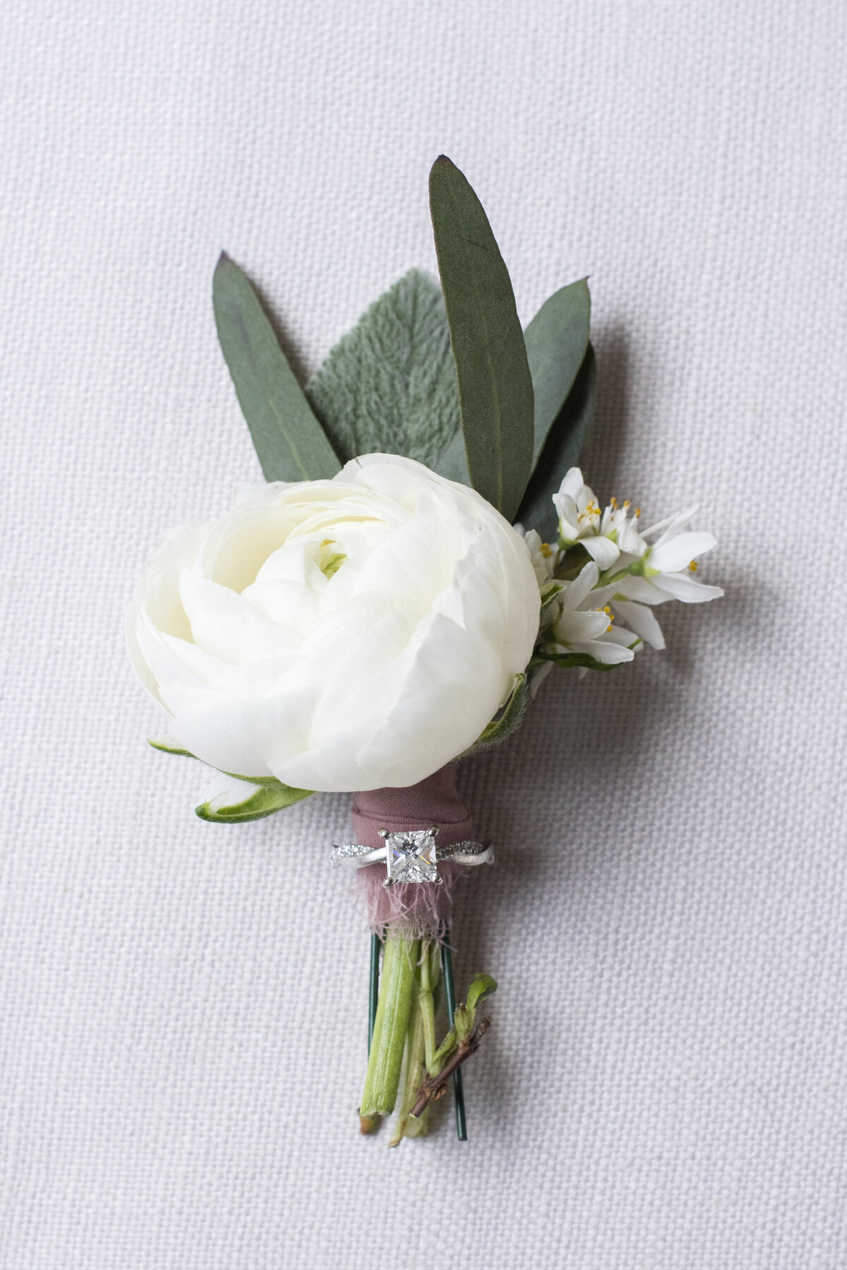 Wedding ring on groom boutonnière Asheville wedding photography Grand Bohemian Hotel