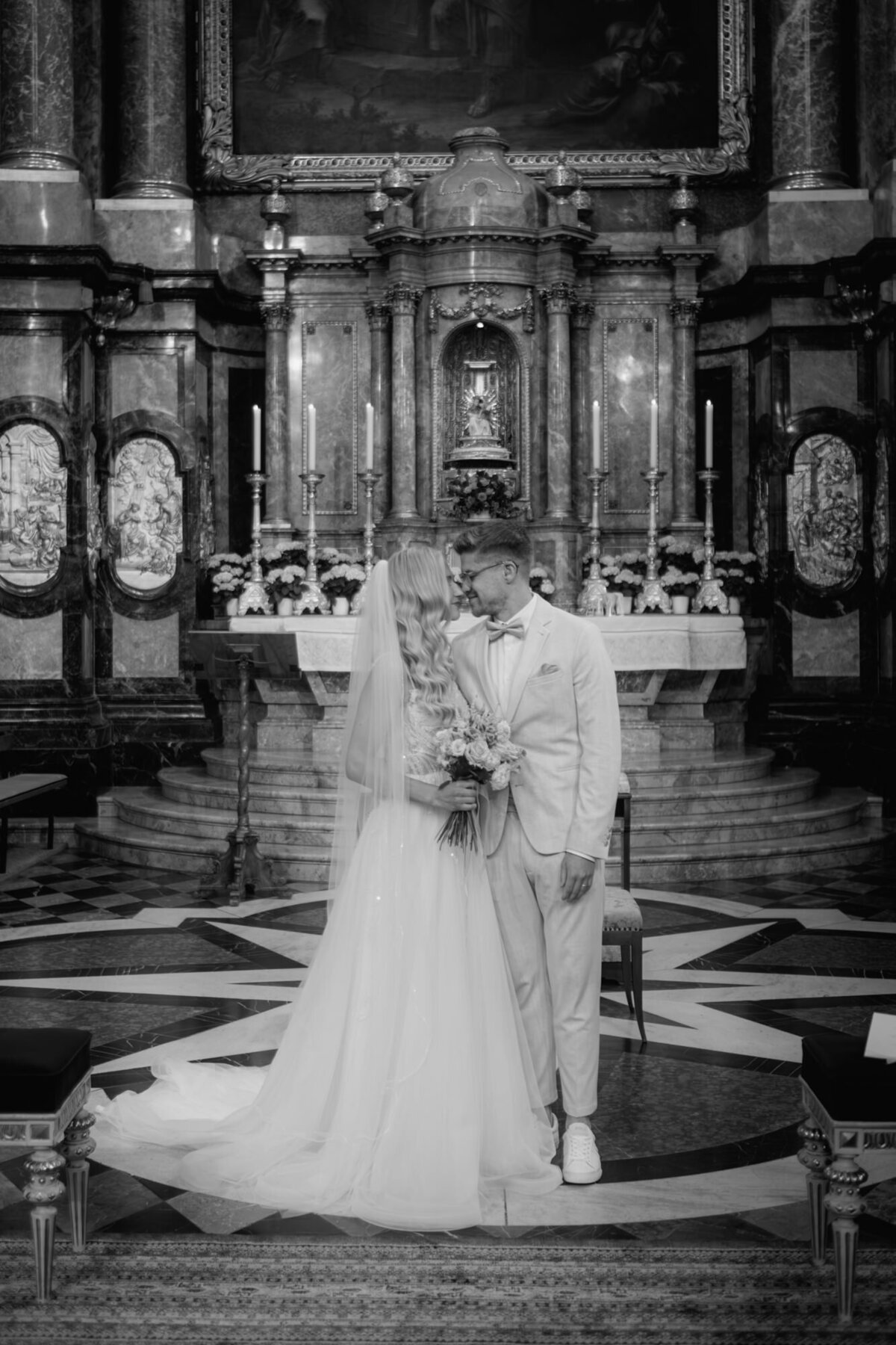 Black and white wedding photography of the newly weds directly after the wedding ceremony in a historical church.