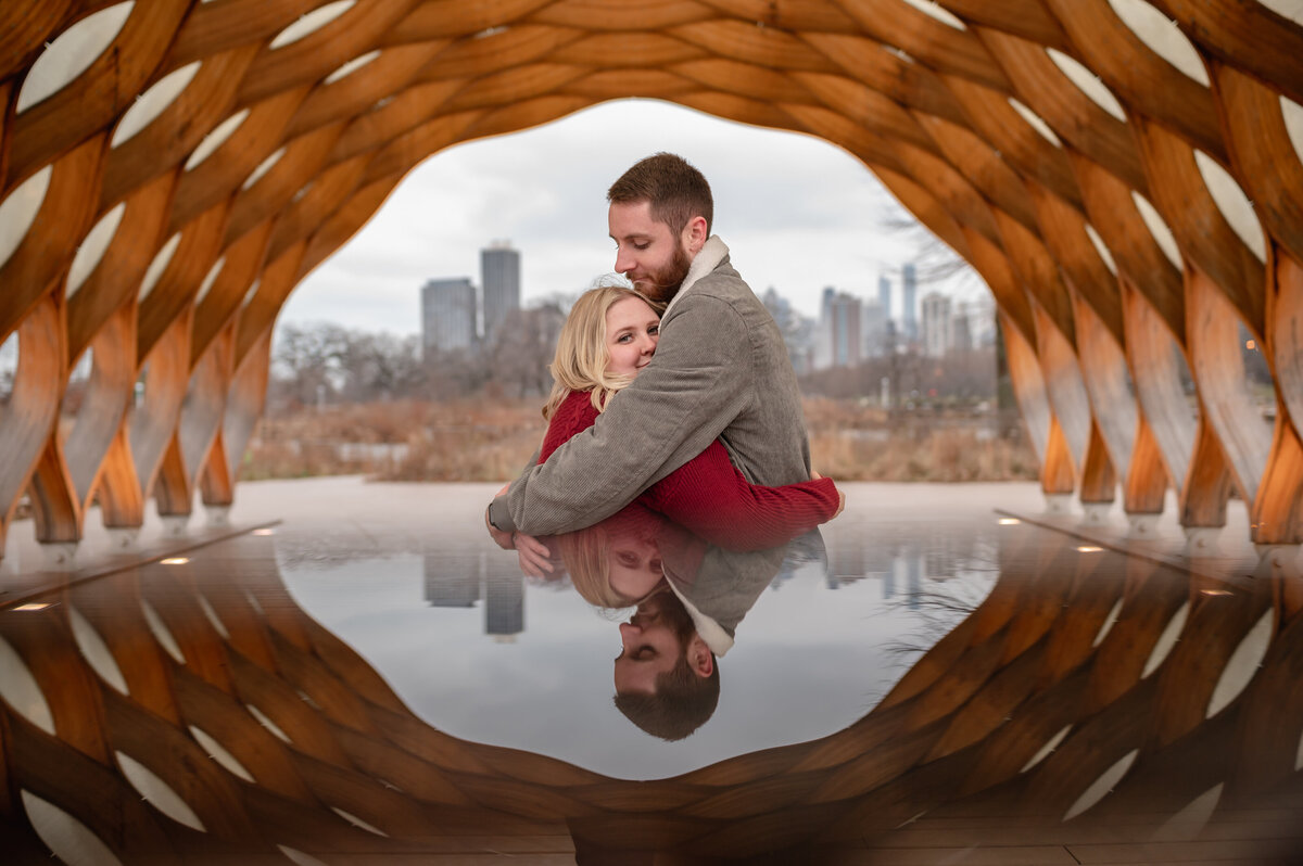 A couple is reflected with the Honeycomb at Lincoln Park