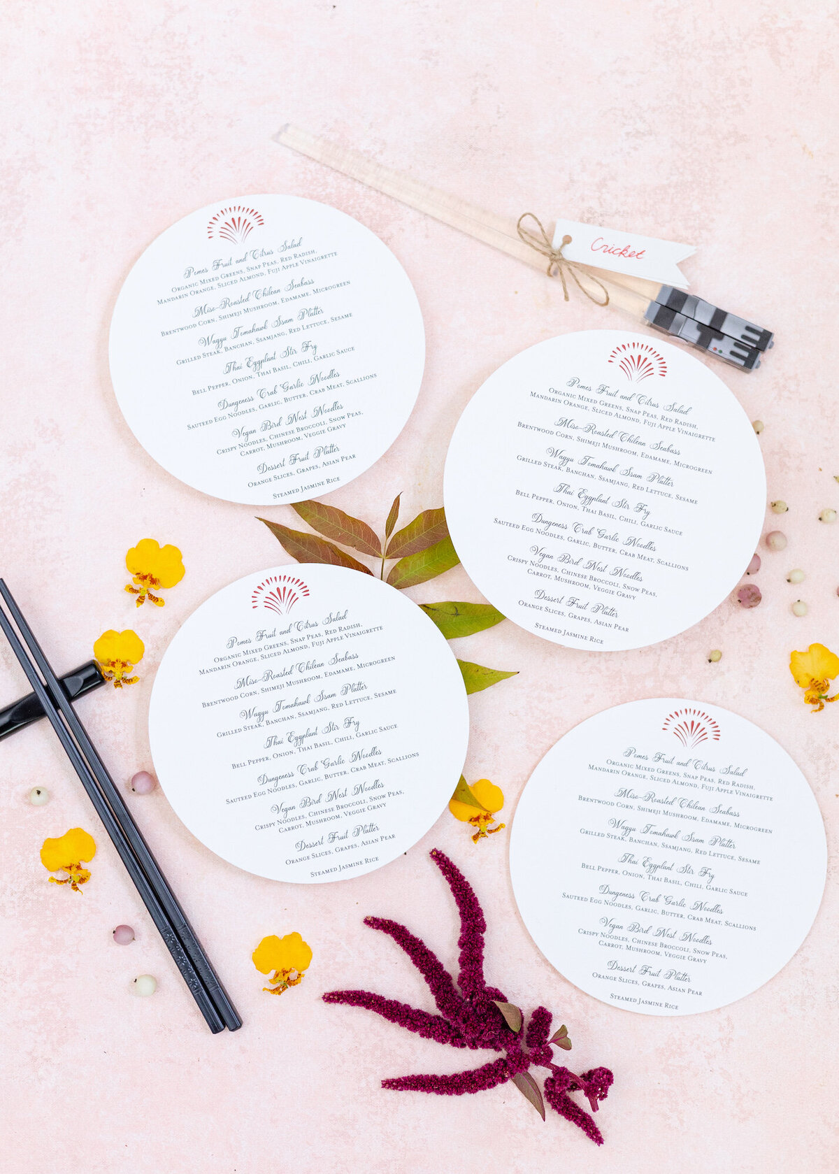 Circular menu flatlay styled with chopsticks and florals