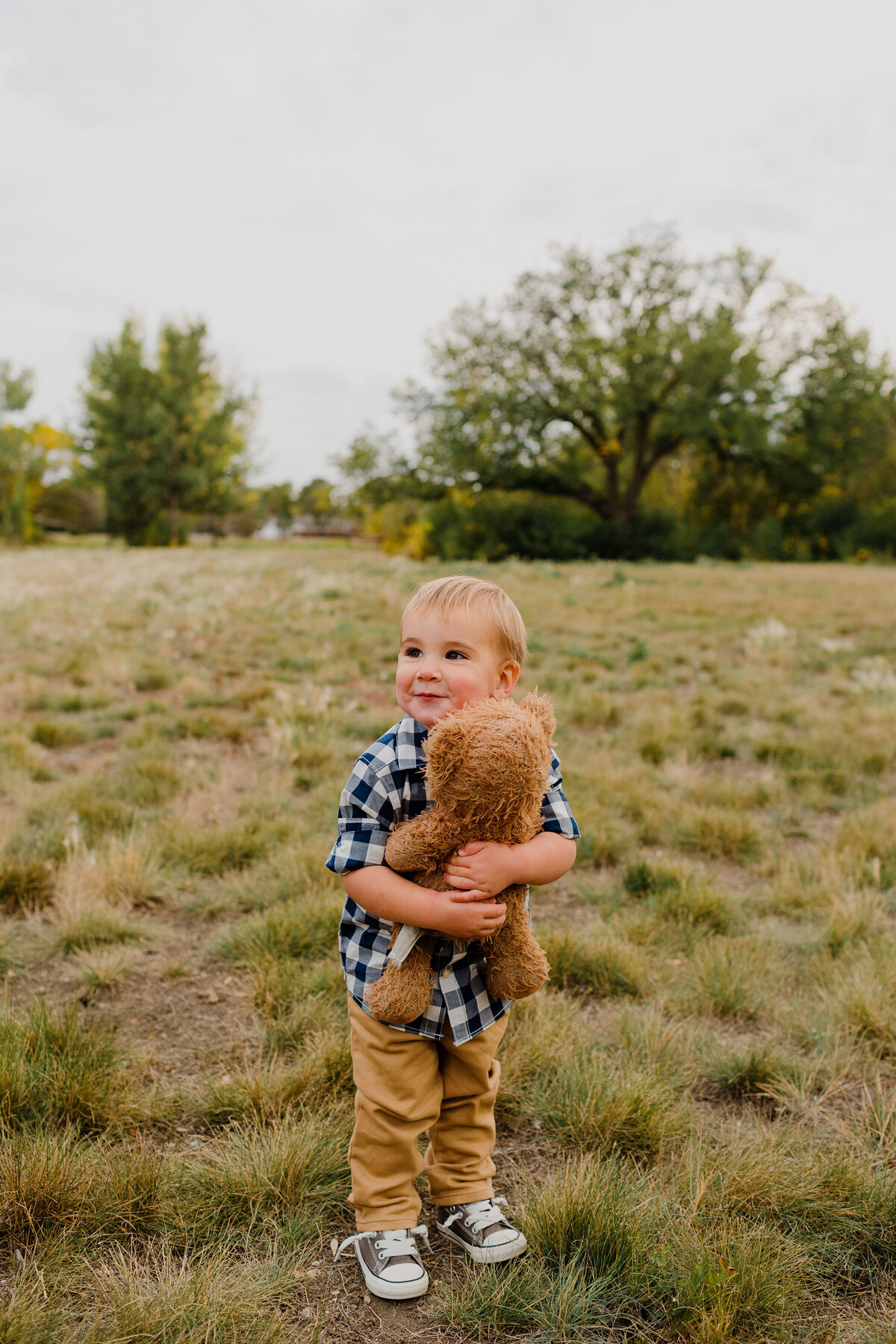 Boy Cuddling Teddy Bear