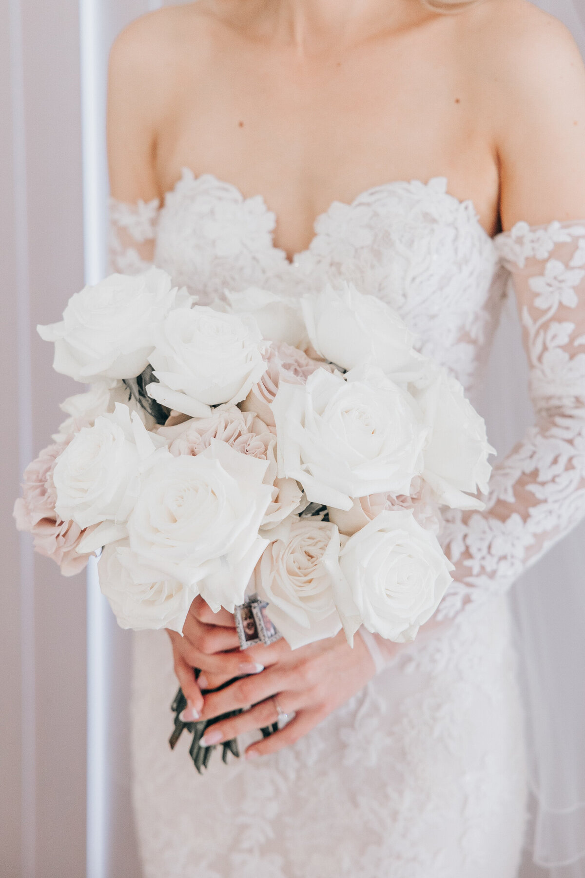 Glamorous white and pink wedding florals photographed by Nova Markina