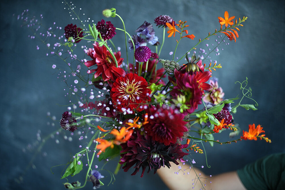 Summer garden-inspired warm colours elegant celebration flower bouquet - Fleuris Studio & Blooms