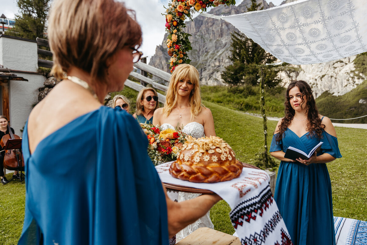 Ukrainian Korovai bread tradition during Dolomites wedding