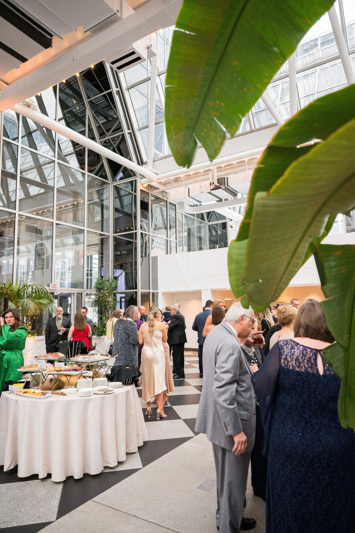 wedding cocktail hour taking place in the front part of wintergarden ppg place event venue
