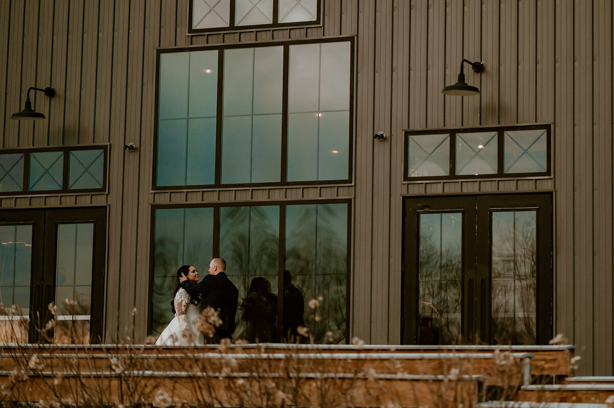 couple-candid-barn-venue-portrait-ashton-hill-farm-cedar-rapids-iowa-storyteller-collective-photo-co